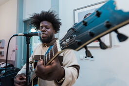 Anjelo Disons plays the guitar