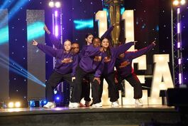 Teens performing on stage 2024