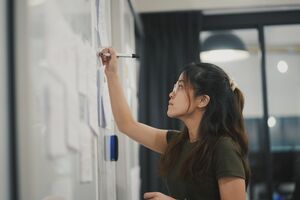 woman writes on wall