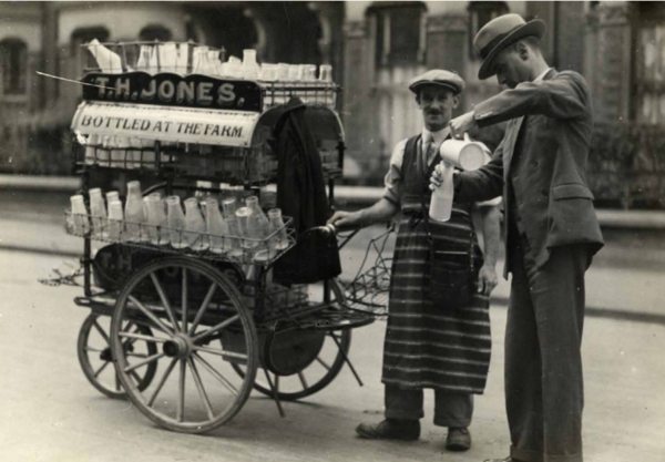Public Health Inspector taking milk sample from T H Jones Dairyman c1936