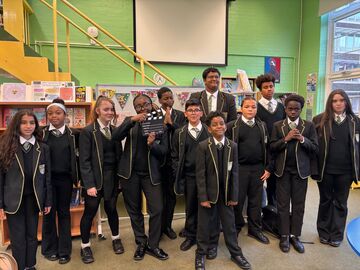 group of students with a clapper board