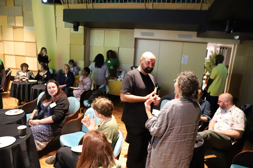 people chat at networking event