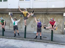 Four costumed dancers in various poses by the Winstanley Estate