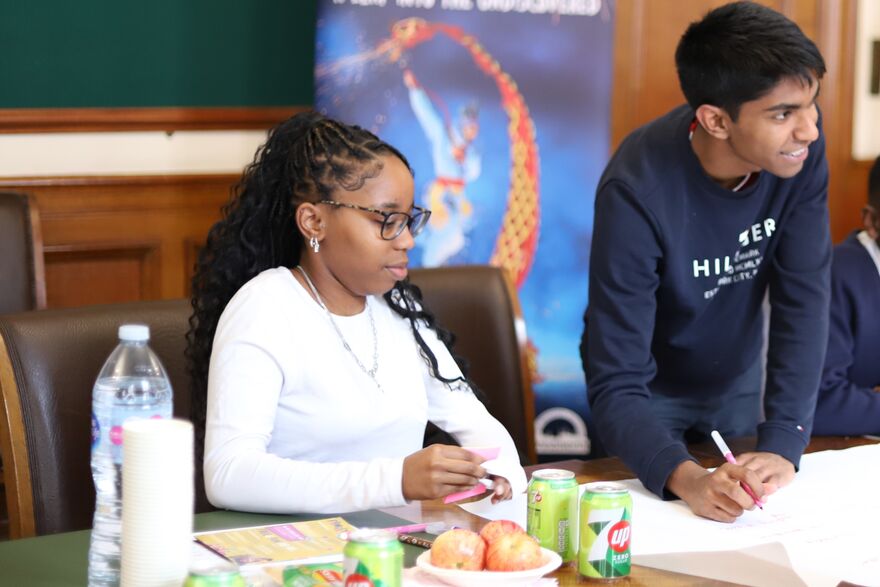 two young people sitting at a table