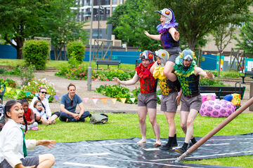 circus company dressed as pigeons on the winstanley estate