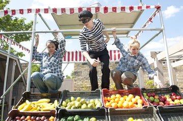 performers at a food market