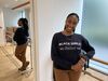 Woman in dance studio smiling at camera