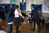 children playing in a school hall