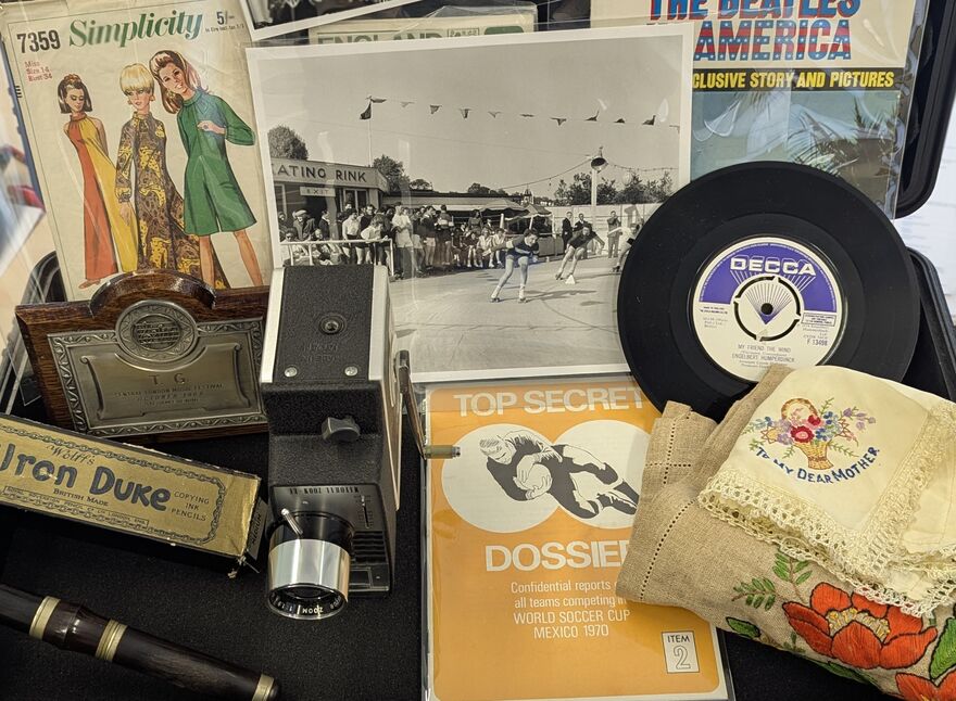 A collectoion of objects inside a Memory Box for Dementia