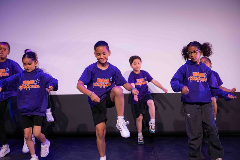 Juniors performing on stage 2024