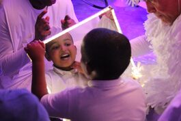 children laughign white clothing