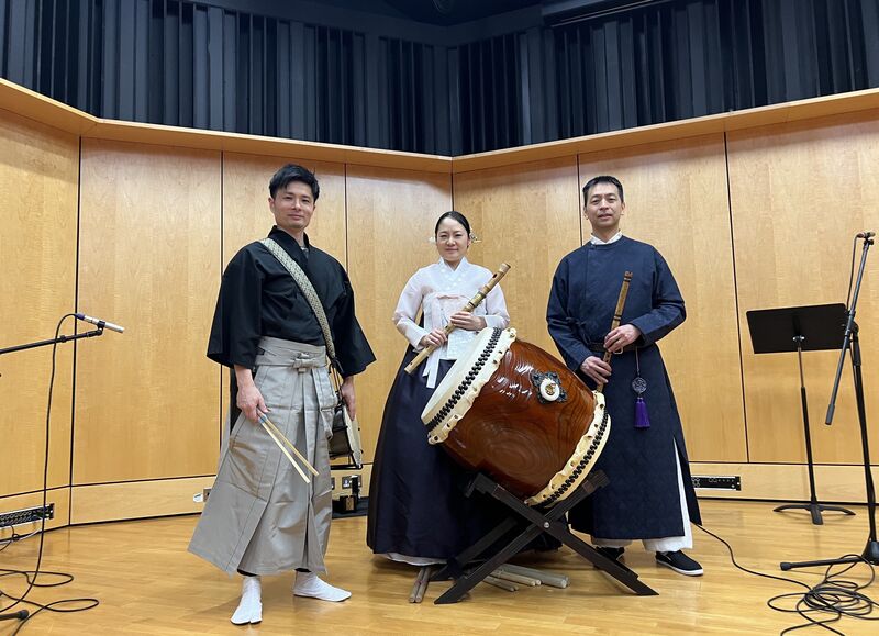 Asian music performers (from left: Japanese Taiko drummer, Korean Daegeum flutist, Chinese Xiao flutist)
