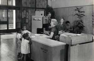 Alvering Library issue desk with young customers, 1961