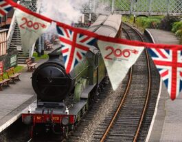 Steam train with banner celebrating 200 years
