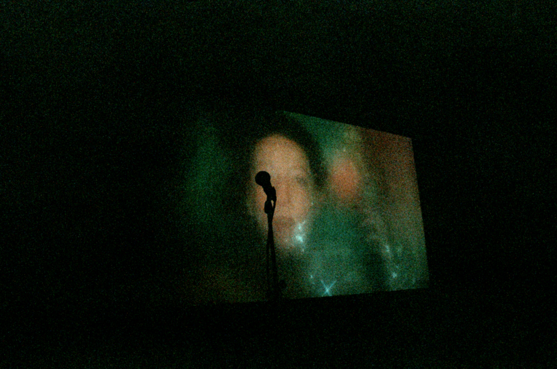 A grainy image of a film being projected