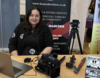 Sandra Munoz-Alvarez in a studio surrounded by camera equiptment