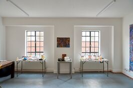 2 windows white with tales under thme open room