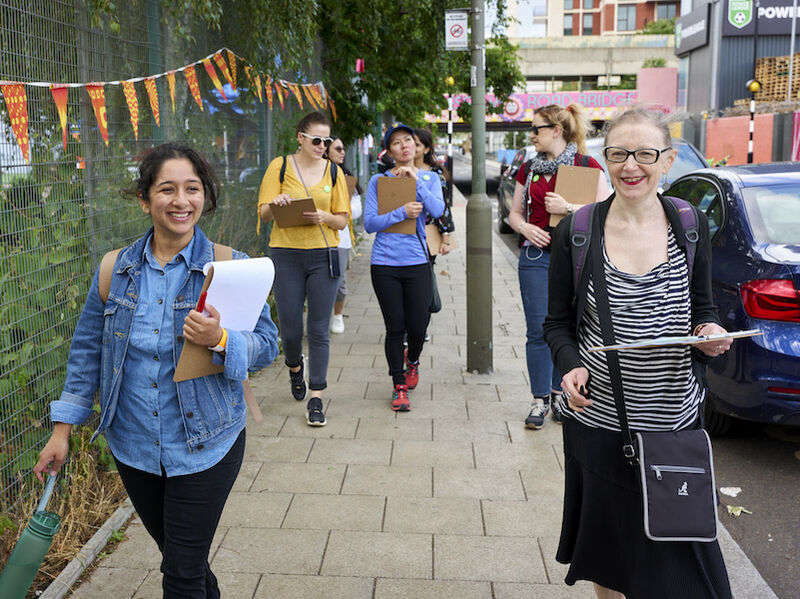 Group of people walking on a road.