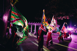 Silk flag procession at night