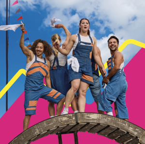 Group of dancers in blue dungarees with orange patches waving white napkins