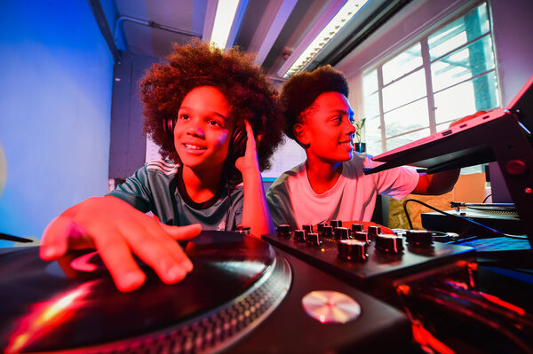 Two children on DJ decks