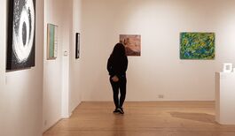 Image of a visitor enjoying a previous ArtCan exhibition