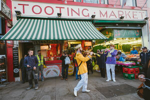 Colourful street band perm in front of Tooting Market