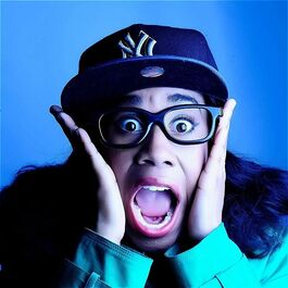 Women in a cap and glasses looking surprised
