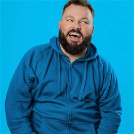Happy bearded man laughing.