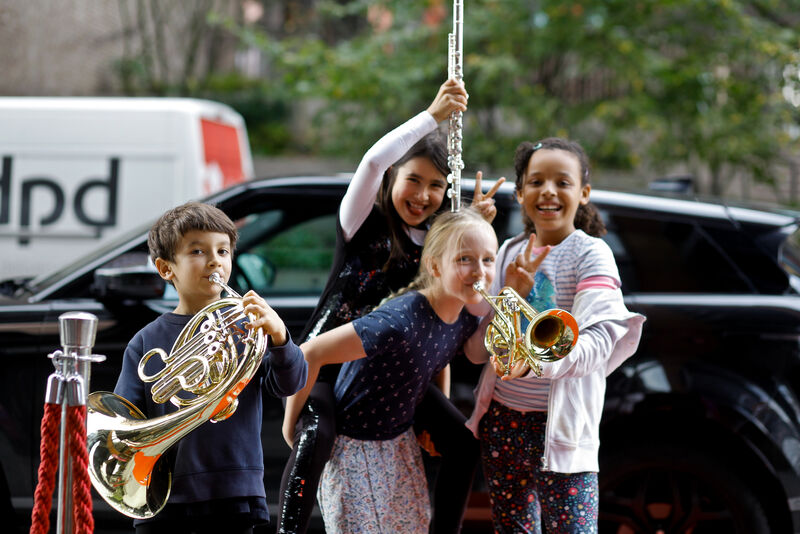 World Heart Beat music students playing their instruments and enjoying themselves