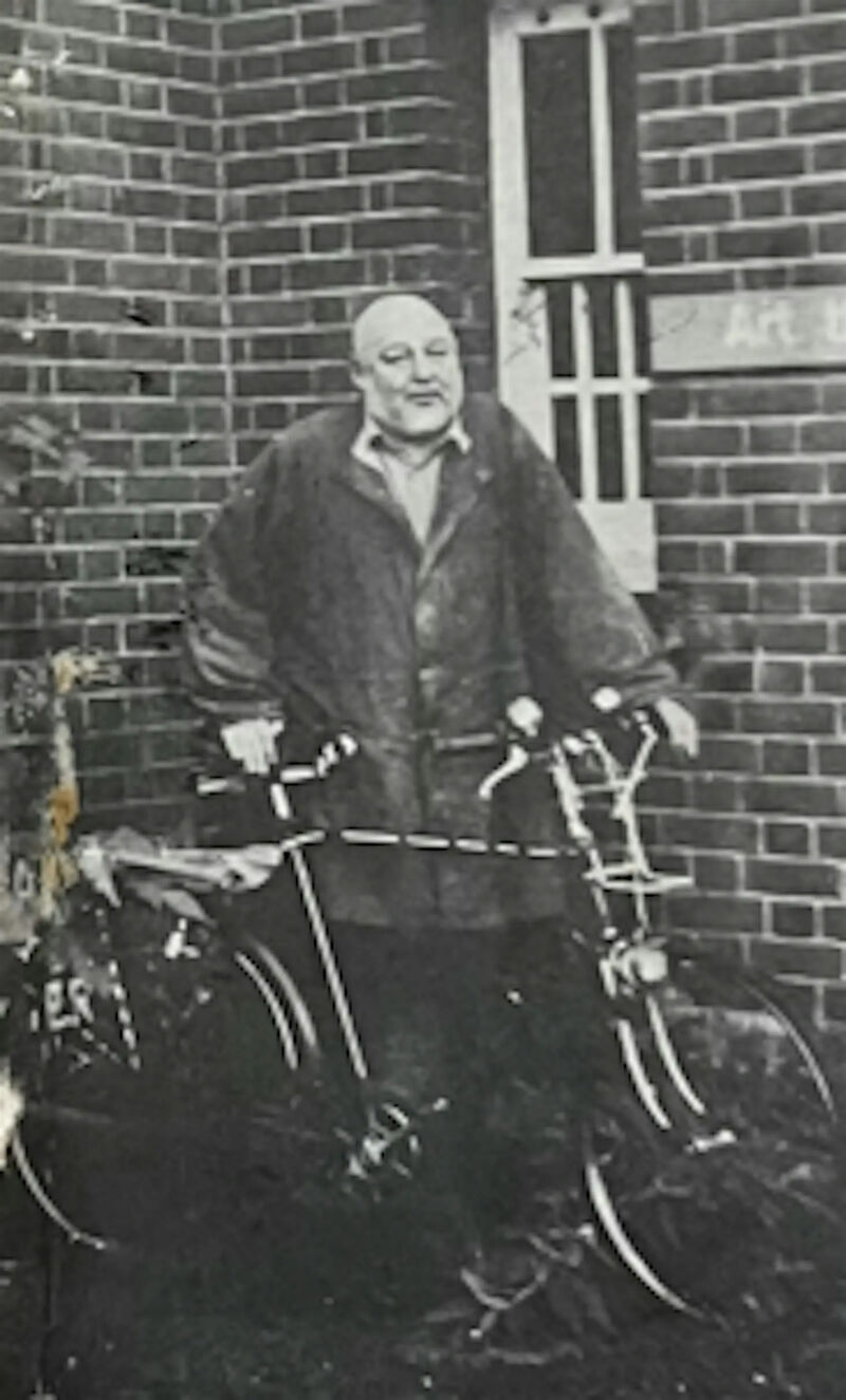 Old Black and white photo of man with bike at Tooting Bec hospital 