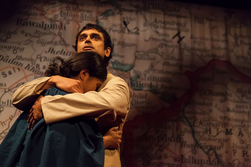 Male actor hugging female actor at an emotional moment,. Image from Child of the Divide 2017 production photo Katherine Leedale