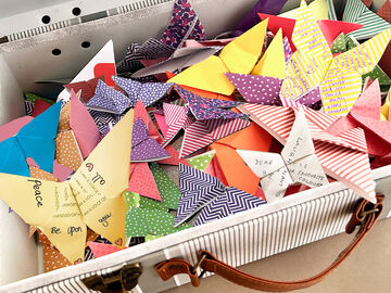 A suitcase full of origami butterflies