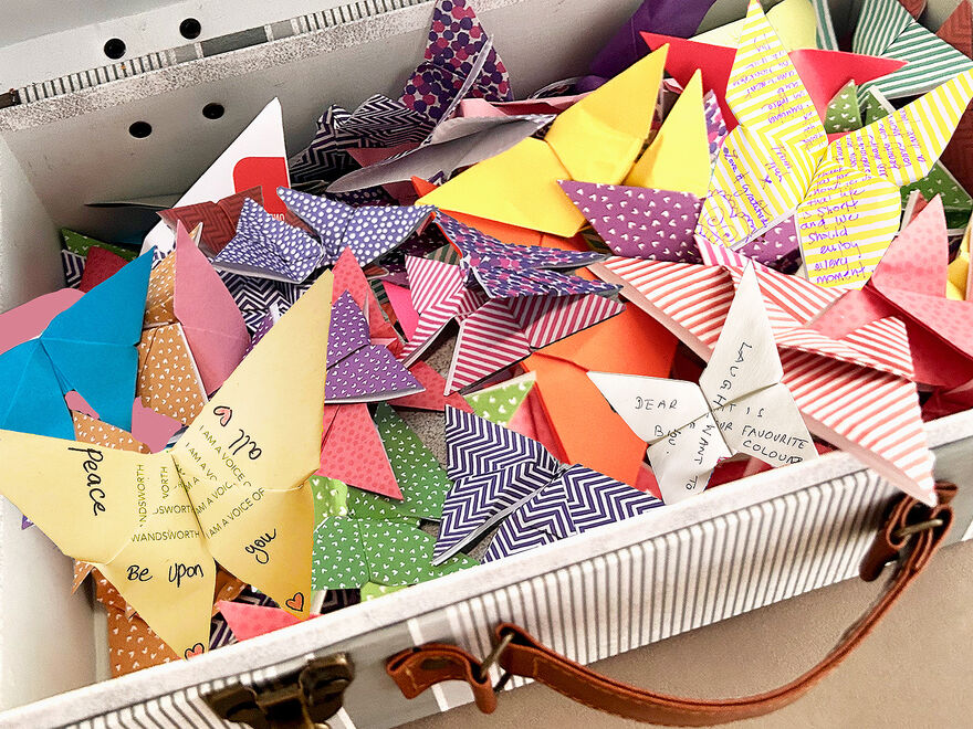 A suitcase full of origami butterflies