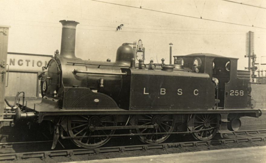Postcard showing a locomotive at Clapham Junction Station. From the Patrick Loobey collection, Wandsworth Libraries & Heritage Service.