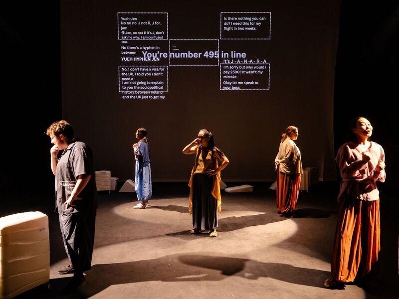 Production shots from Transit - the first is a group of actors crowded around a tower of suitcases while one pretends to take a selfie using a smaller suitcase; the second is a group of actors standing behind a row of suitcases with projections describing how much they've spent on migrating to the UK; the third is a group of actors clumped together in low light, their arms stretched out to the ceiling mid-contemporary dance; the fourth is an actor standing in between two harsh lights with words projected over her face; the fifth is five actors standing in the corners and centre of the stage, 'talking' to the home office via mimed phones.