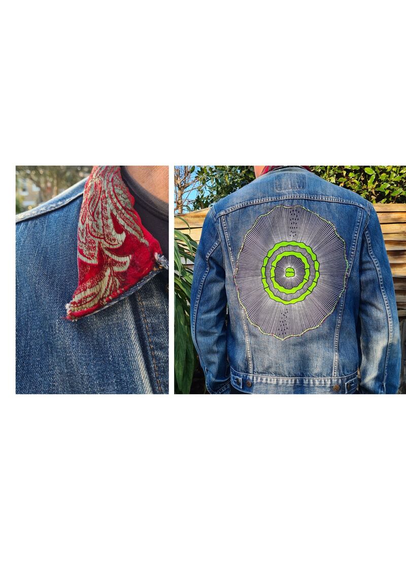 Upcycled denim jacket showing a new collar made from velvet curtain material and an African print cut out embroidered to the back of the jacket