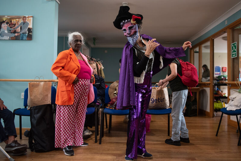 Masked performer gets ready.