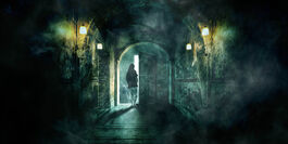 Someone is walking through a door at the end of a long corridor with an arched ceiling. There are lamps on the walls that give a green tinge to the image, and there is an unearthly haze in the air. 