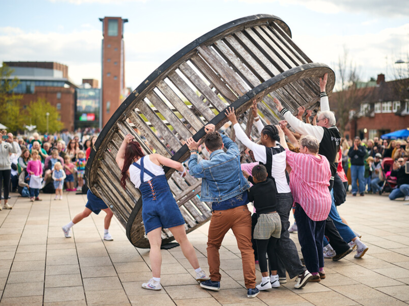 Community Cast pushing the Giant Wheel