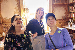 Three women looking with wonder at the interior design of 575 Wandsworth Road.