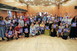 Joseph Coelho and a group of teachers all holding his book Poetry Prompts