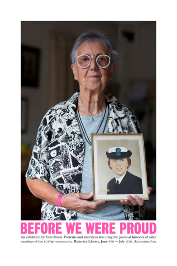 This photograph shows a woman (Vito) holding a portrait of herself as a young woman and a naval wren. She is around 70 and is wearing round white spectacles and a patterned black and white cardigan.