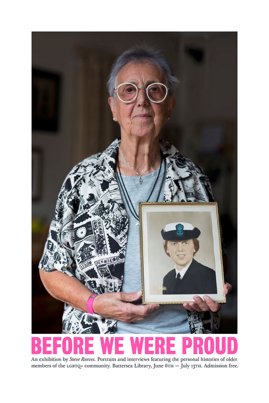 This photograph shows a woman (Vito) holding a portrait of herself as a young woman and a naval wren. She is around 70 and is wearing round white spectacles and a patterned black and white cardigan.