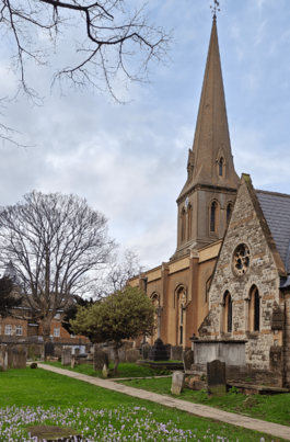 Image shows the exterior of St Leonard's church on a spring day