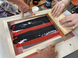 Two Sets Of Hands Creating Art