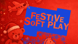 Text overlaid on image is transparent against a dark navy background. It reads ‘Festive Soft Play’. At the bottom of the treatment the blue background fades into snowflakes. A graphical image of lots of different Christmas toys – a teddy bear, a rocking horse, a toy airplane – gathered underneath a Christmas tree with fairy lights on it. All the image apart from the title treatment is a very merry red.  