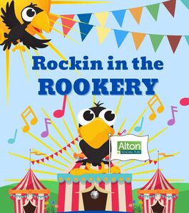 a cheeky looking cartoon cockerel sitting on top of red and white stripy circus tens