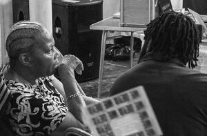 black and white photo of two people in conversation