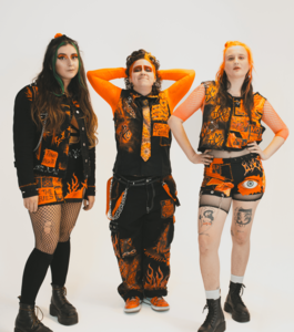 The Menstrual Cramps wearing black and orange standing in front of a white background